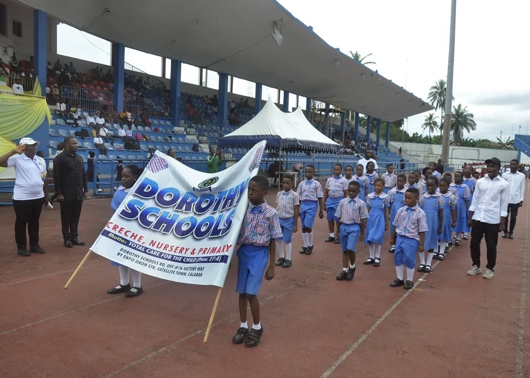 Dorothy schools march past in stadium track